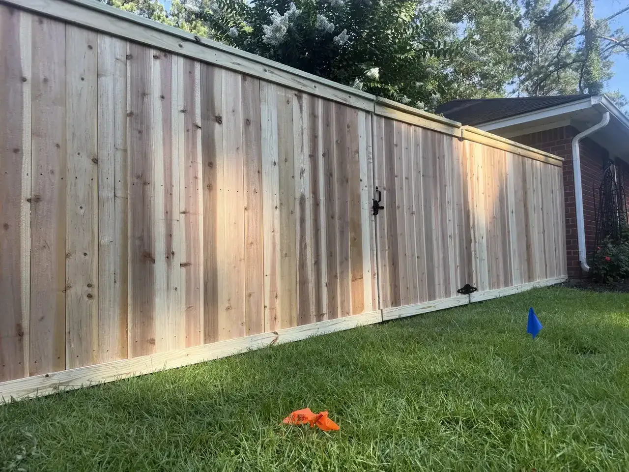 Cap and Trim wood privacy fence with custom gate